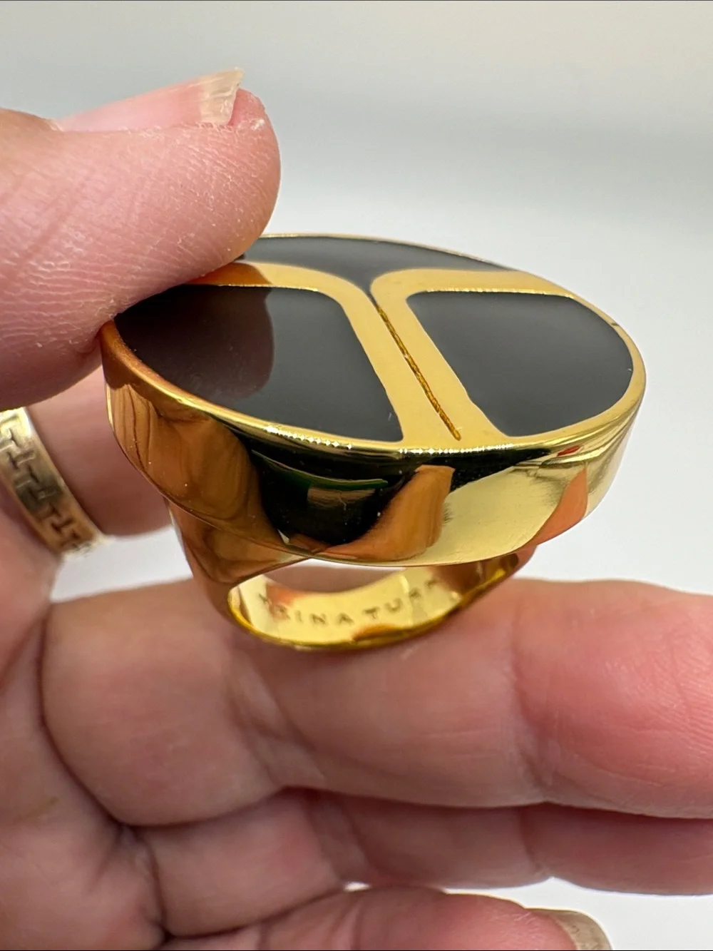 Trina Turk Gold Tone Ring with Black Enamel Initials Inlay